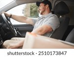 Happy, delivery man or driving in car with box, smile or package for product in commercial shipping. Driver, ready or courier worker in freight industry, supply chain or trailer on road for service