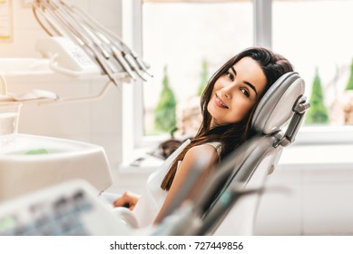 Happy Dental Patient In The Dental Chair