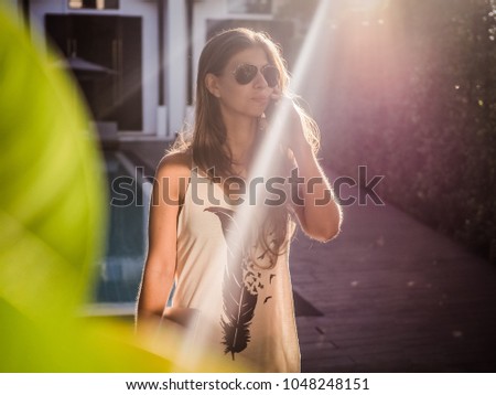 Similar – Young surfer woman with top and bikini kissing surfboard