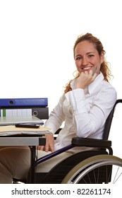 Happy Disabled Business Woman At Work On Her Desk