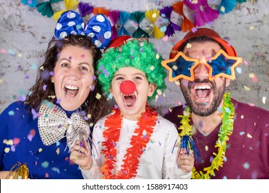 Happy Disguised Family Celebrating Carnival At Home.