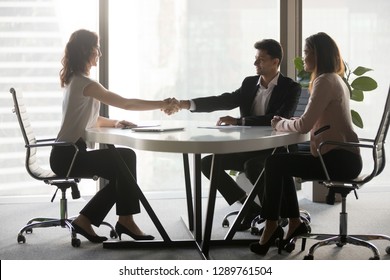 Happy Diverse Business Partners Handshaking At Office Meeting, Arab Hr Congratulates Job Seeker Shake Hands Hiring Concept, Respect, Make Deal First Impression, Thank For Cooperation Partnership