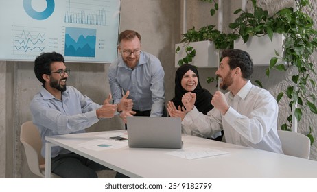 Happy diverse business people multiracial team group celebrate sales growth success on laptop excited businessmen and businesswoman win unity teamwork goal victory achievement show thumbs up in office - Powered by Shutterstock