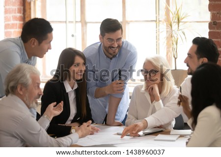 Similar – Image, Stock Photo Trainer and client interacting with an EMS training vest in a bright room with a plant in background at a EMS