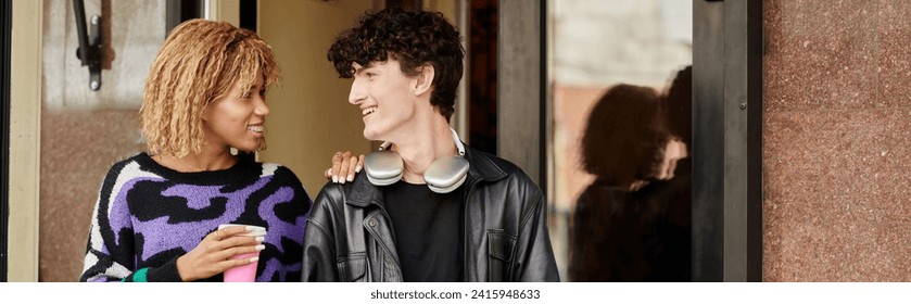 happy diverse couple in casual attire walking with plant based cappuccino from vegan cafe, banner - Powered by Shutterstock