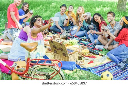 Happy Diverse Culture Friends Taking Selfie Portrait At Picnic Party Outdoor - Young People Drinking Wine,eating And Having Fun Together - Friendship Concept - Focus On Afro Girl Face - Warm Filter