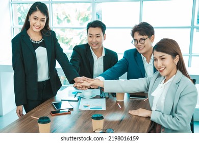 Happy Diverse Employees Team Celebrating Teamwork Success, Business Achievement At Meeting. Group Of Successful Happy Business People Working As A Team In Office On Meeting.