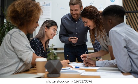 Happy Diverse Employees Working With Legal Documents At Meeting In Boardroom Close Up, Smiling Businesspeople Reading Financial Report, Project Statistics, Sharing Startup Ideas At Briefing In Office