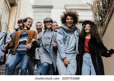 Happy diverse friends having fun around the city - Focus on right girl face - Powered by Shutterstock