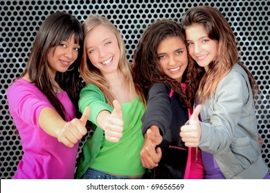 Happy Diverse Group Of Teenage Girls Showing Thumbs Up