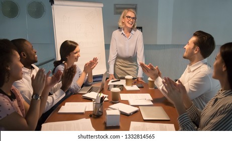 Happy diverse team people young employees interns applaud thank old happy mentor coach for good presentation training celebrating success support leader congratulating, appreciation gratitude, late - Powered by Shutterstock