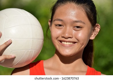 Happy Diverse Teen Athlete Female Volleyball Player With Volleyball