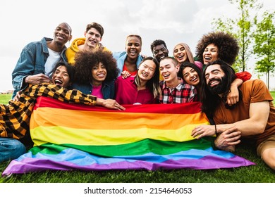 Happy diverse young friends celebrating gay pride festival - LGBTQ community concept 