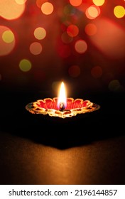 Happy Diwali. Diya Lamp Lit, Colorful Rangoli, Dark Bokeh Light Background. Deepavali Hindu Festival Of Lights Celebration.
