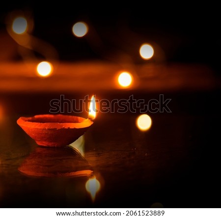 Happy Diwali - Diya lamps lit during diwali celebration