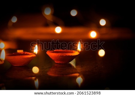 Happy Diwali - Diya lamps lit during diwali celebration