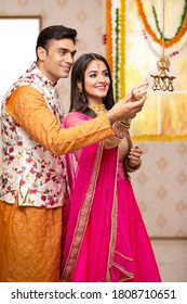 Happy Diwali Family Celebration In India. Husband And Wife Celebrating Diwali Festival.