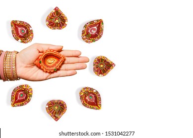 Happy Diwali - Woman Hands With Henna Holding Lit Candle Isolated On White Background. Hindu Festival Of Lights Celebration. Copy Space For Text.