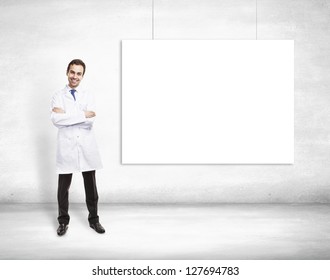 Happy Doctor And Blank Poster On Wall