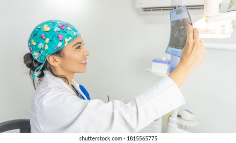 Happy Doctor Checking X Ray Plate At The Hospital