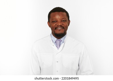 Happy Doctor Man With Small Beard In White Coat Bright Shirt Isolated On White Background. Smiling Adult Black African American Physician Therapist Portrait, Pleasant Excited Candid Male Emotion