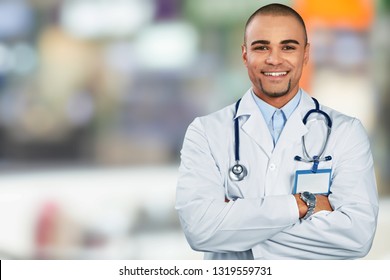 Happy doctor on background - Shutterstock ID 1319559731