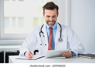 Happy Doctor Writing Prescription