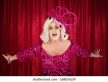 Happy Drag Queen In Blond With Singing In Theater