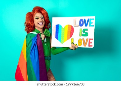 Happy drag queen celebrating gay pride holding banner with rainbow flag symbol of LGBTQ community - Focus on banner
 - Shutterstock ID 1999166738