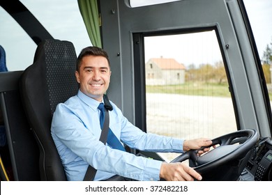 happy driver driving intercity bus - Shutterstock ID 372482218