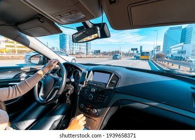 Happy Driver Inside Car At Sunset. Young Woman Have Fun Ride Trip Travel On Road In Winter Sunny Day. Drive Vacation Concept