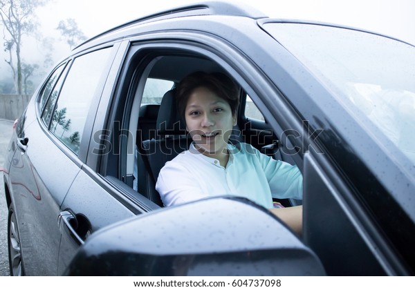 Happy Driver on Luxury  Black\
Car