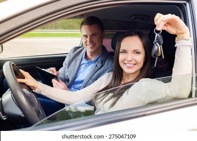 Happy driving student with a car keys - Powered by Shutterstock