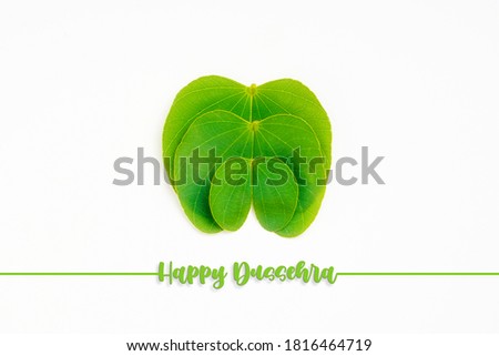 Happy Dussehra greeting card , green apta leaf and rice, Indian festival dussehra