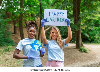 Happy Earth Day! People Cleaning Up Litter On Grass. Group Of International Young People Building Team Outdoor In Park. Volunteer Together Pick Up Trash In The Park