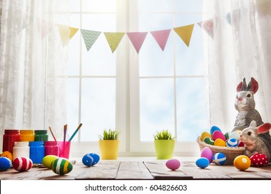 Happy Easter! Background With Colorful Eggs In Basket. Table Decorating For Holiday.