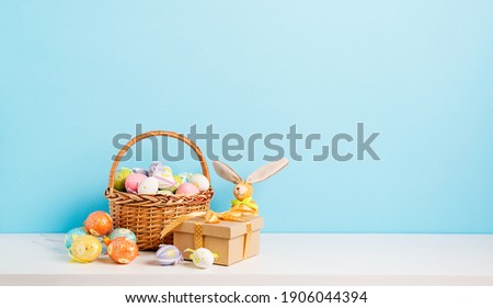 Happy Easter background. Congratulatory easter background. Easter colorful  eggs and gift.