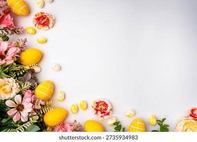 Happy Easter background with easter eggs and spring flowers. Easter background with copy space. Flat lay. High quality photo