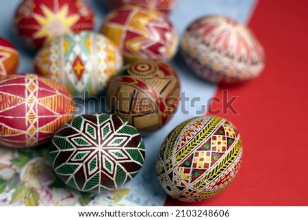 happy easter card. beautiful Easter egg Pysanka handmade on a red background
