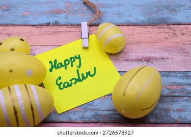 happy easter card between easter eggs on rustical wooden background