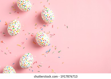 Happy Easter card. Frame made of colorful speckled Easter eggs on pink background. Flat lay, top view, copy space. - Powered by Shutterstock