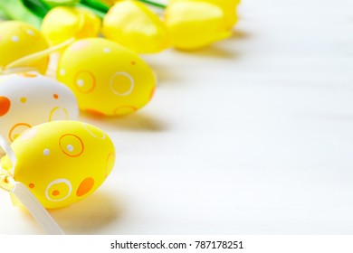 Happy Easter. Congratulatory easter background. Easter eggs and flowers. - Shutterstock ID 787178251