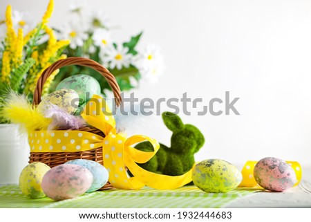 Happy Easter. Congratulatory easter background. Easter eggs and flowers. Background with space for copying. Selective focus.