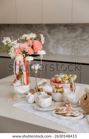 Happy Easter decor on the table in the kitchen. Eggs, Easter cake, sweets, flowers, basket and candles. Easter decoration traditions