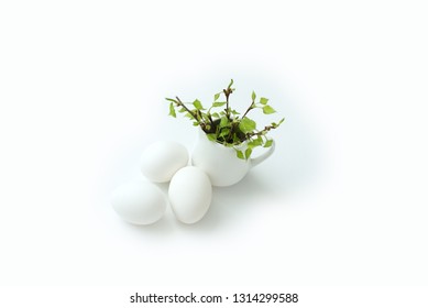 happy easter egg and branch with young leaves on white   background 