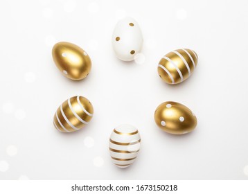 Happy Easter eggs white background. Golden shine decorated eggs in basket, for greeting card, promotion, poster. - Powered by Shutterstock