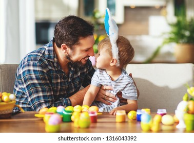 Happy easter! family father and child son with ears hare getting ready for holiday
 - Powered by Shutterstock