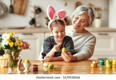 Happy Easter! Family Grandmother And Child Granddaughter With Ears Hare Getting Ready For Holiday
