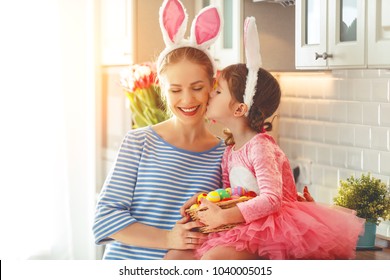 Happy Easter! Family Mother And Child Daughter With Ears Hare Getting Ready For Holiday
