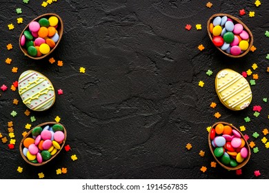 Happy Easter flat lay of chocolate eggs and sweets, top view
